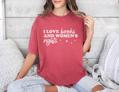 A comfort colors shirt with the saying "I love books and women's rights"