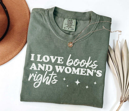 A comfort colors shirt with the saying "I love books and women's rights"