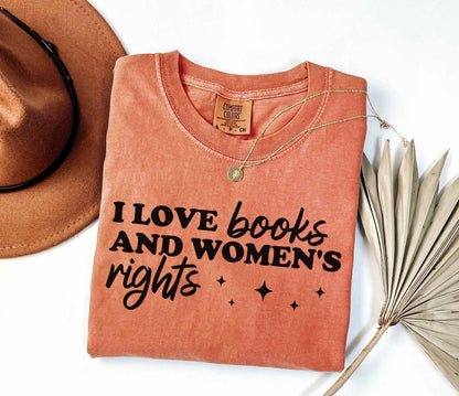A comfort colors shirt with the saying "I love books and women's rights"