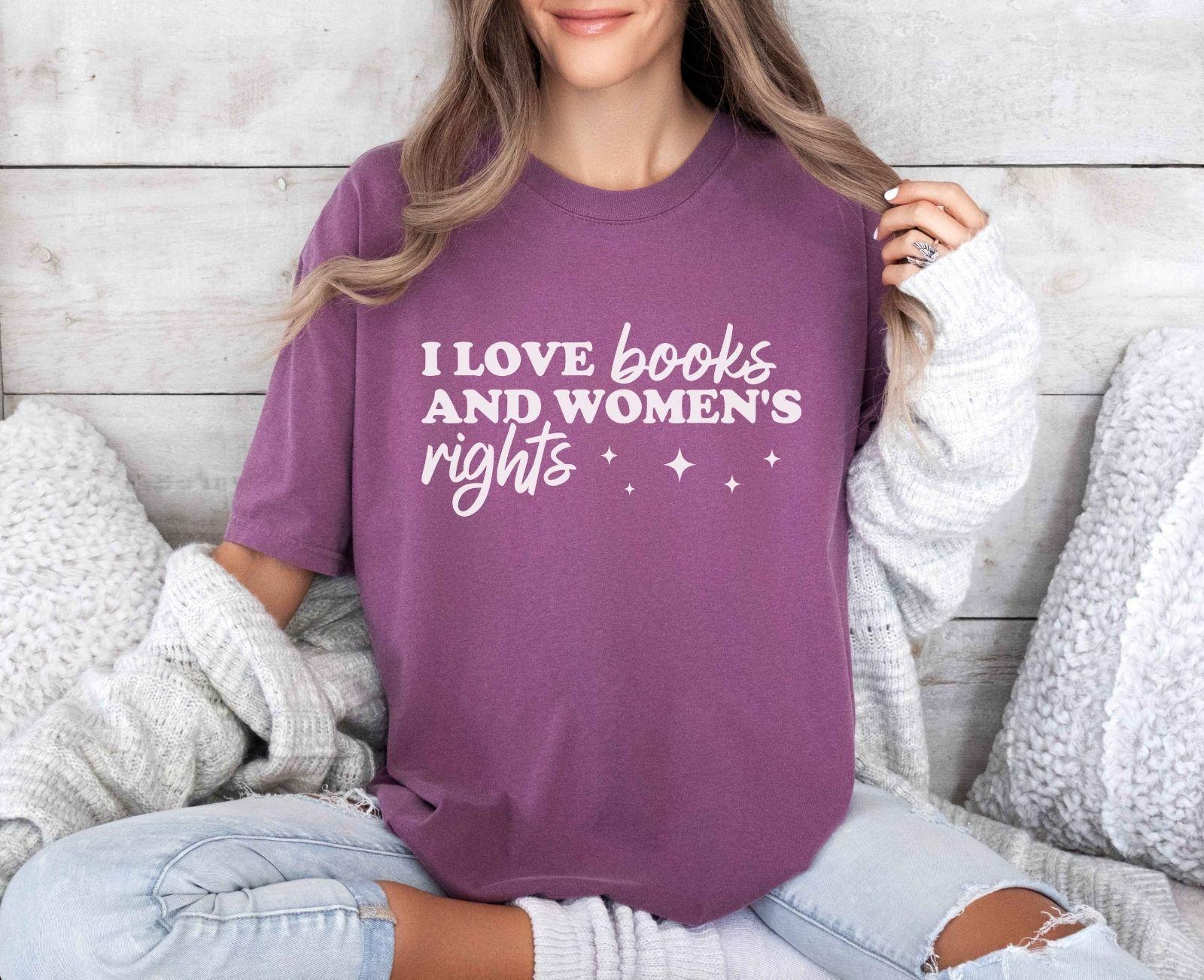 A comfort colors shirt with the saying "I love books and women's rights"