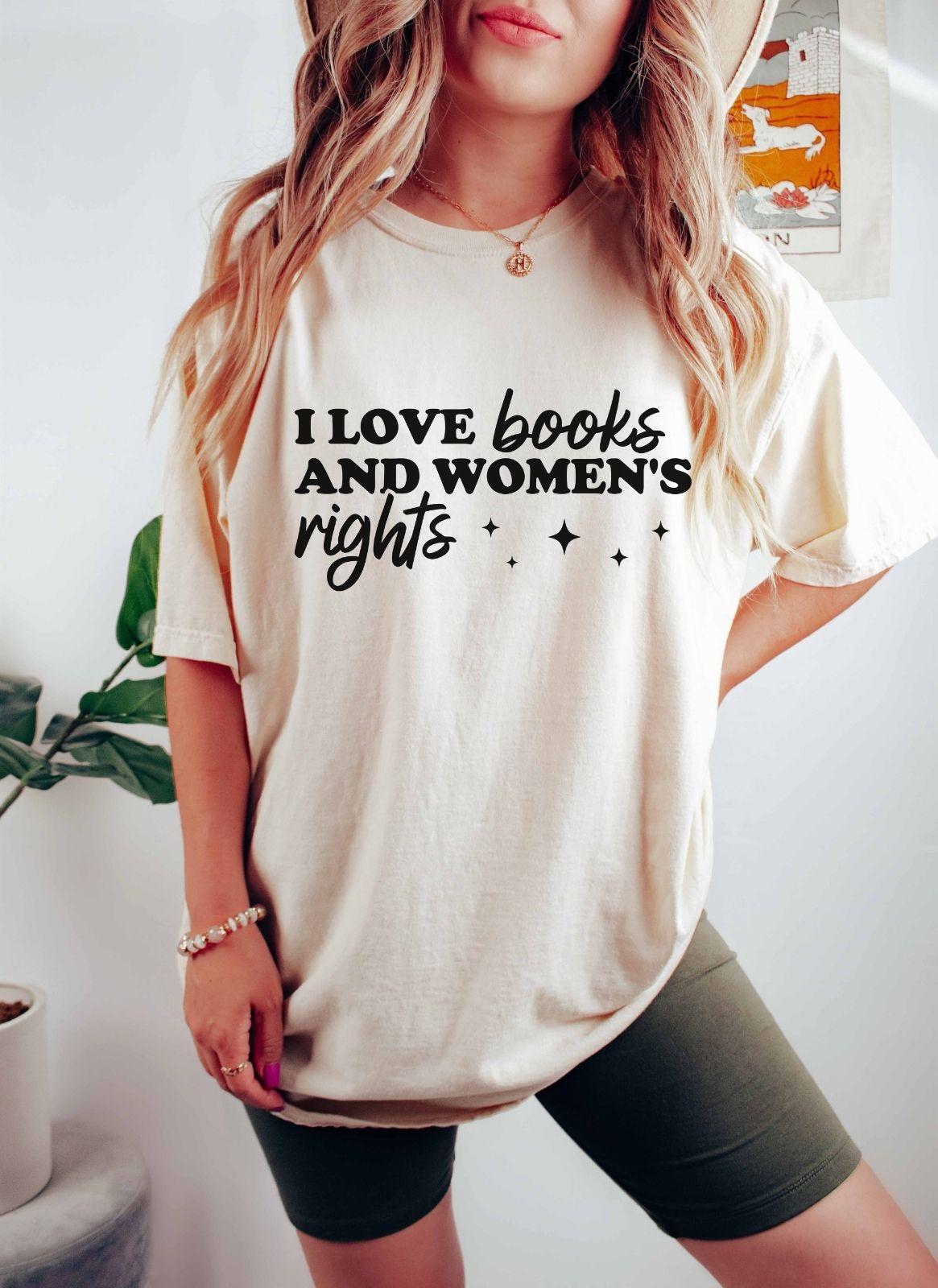 A comfort colors shirt with the saying "I love books and women's rights"
