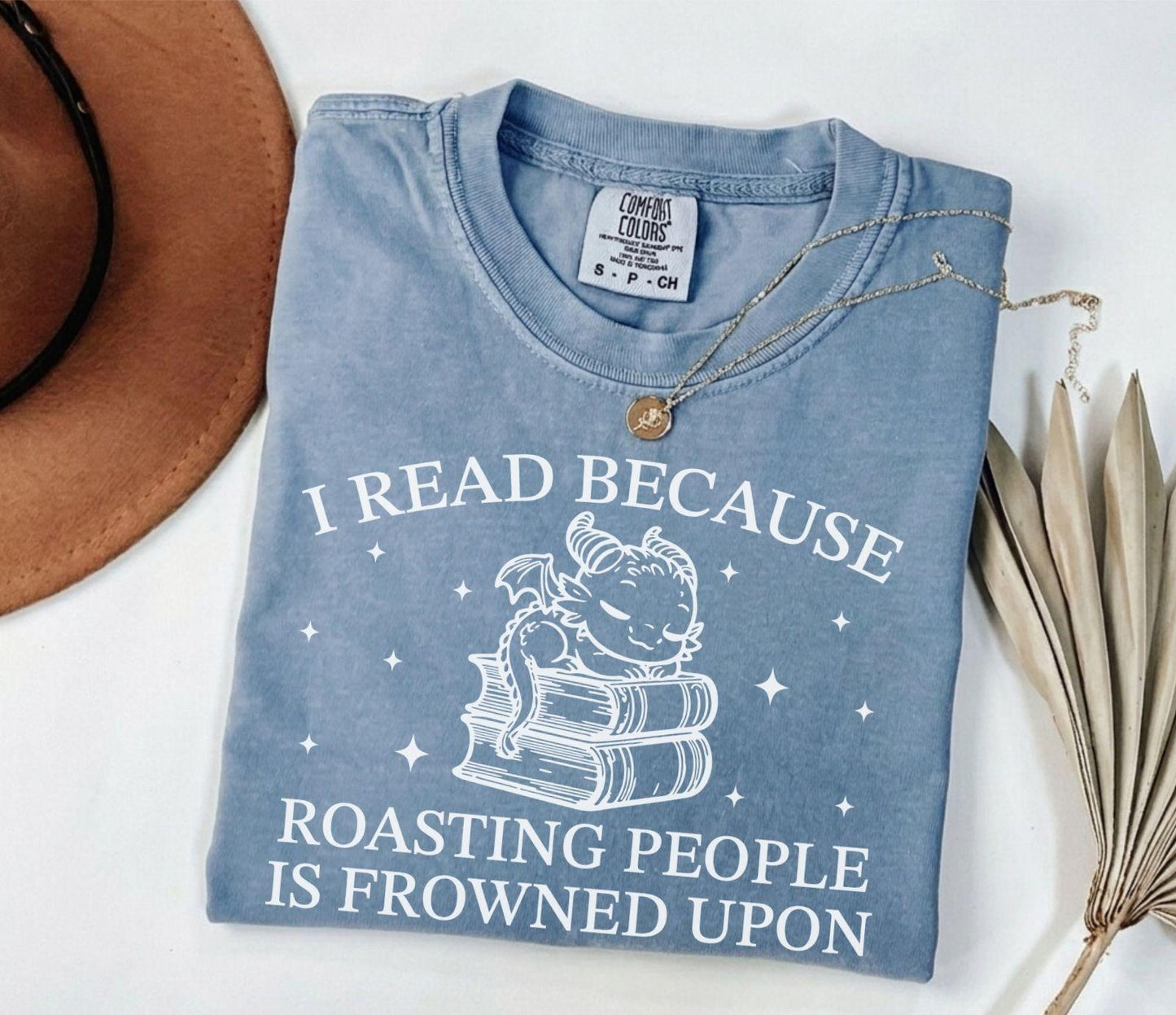 A comfort colors® shirt with the saying "I read because roasting people is frowned upon"