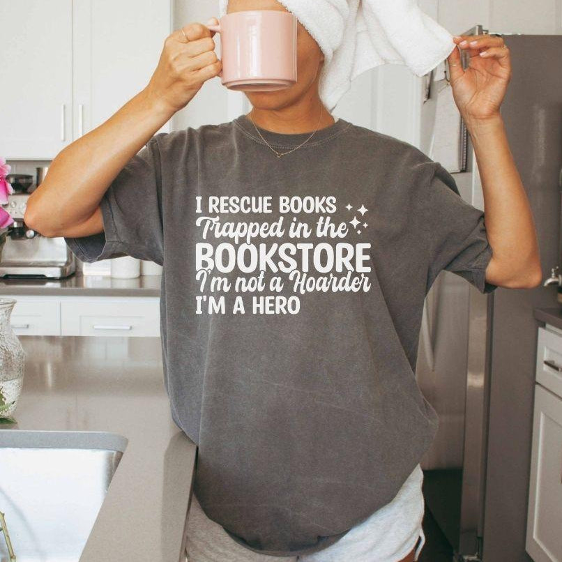 A comfort colors® shirt with the saying "I Rescue Books Trapped In The Bookstore"