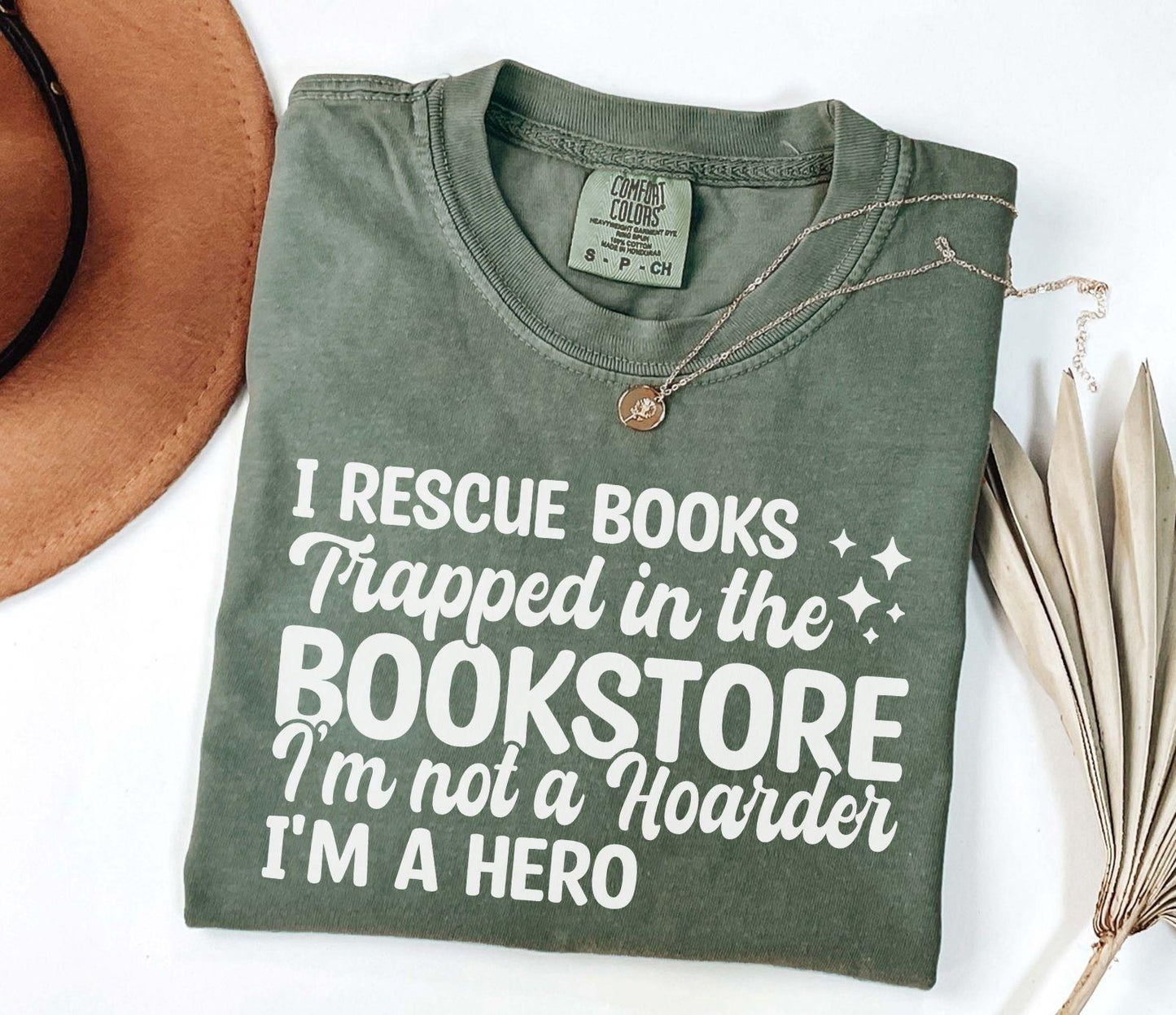 A comfort colors® shirt with the saying "I Rescue Books Trapped In The Bookstore"
