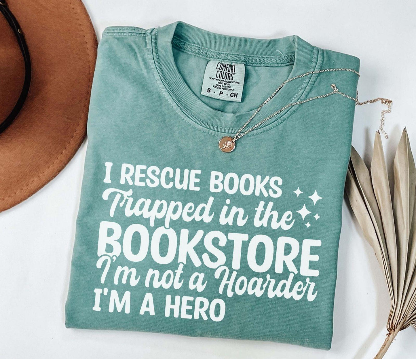 A comfort colors® shirt with the saying "I Rescue Books Trapped In The Bookstore"