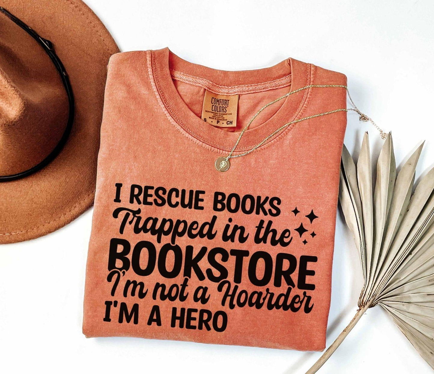 A comfort colors® shirt with the saying "I Rescue Books Trapped In The Bookstore"