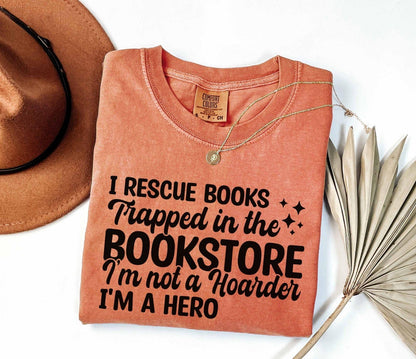A comfort colors® shirt with the saying "I Rescue Books Trapped In The Bookstore"