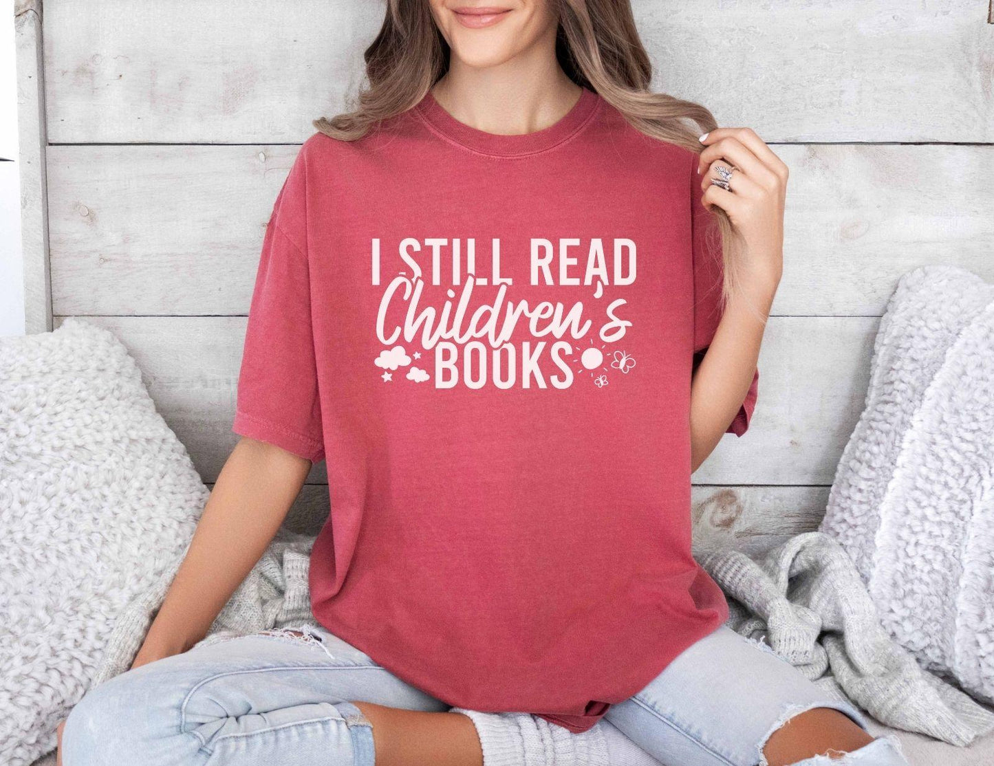 A comfort colors® shirt with the saying "I still read children's books"