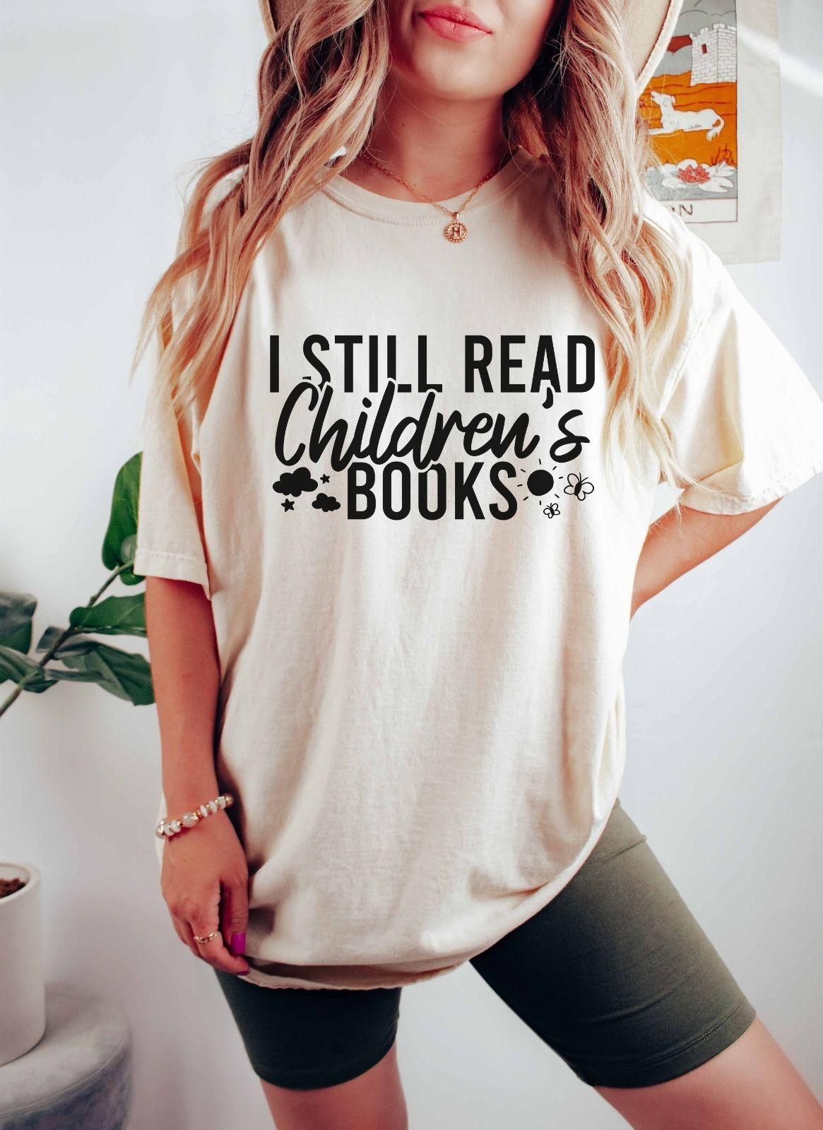 A comfort colors® shirt with the saying "I still read children's books"
