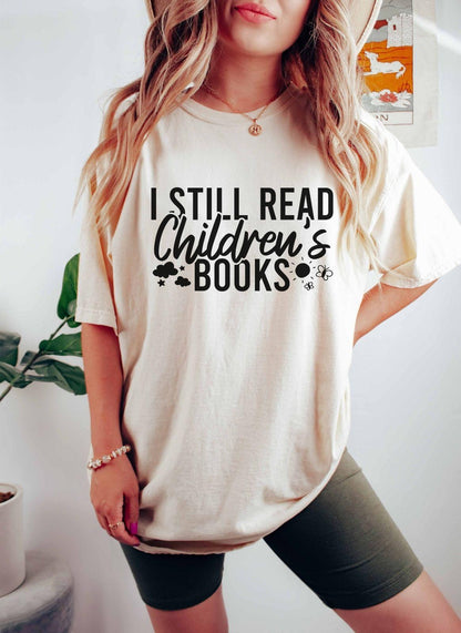 A comfort colors® shirt with the saying "I still read children's books"