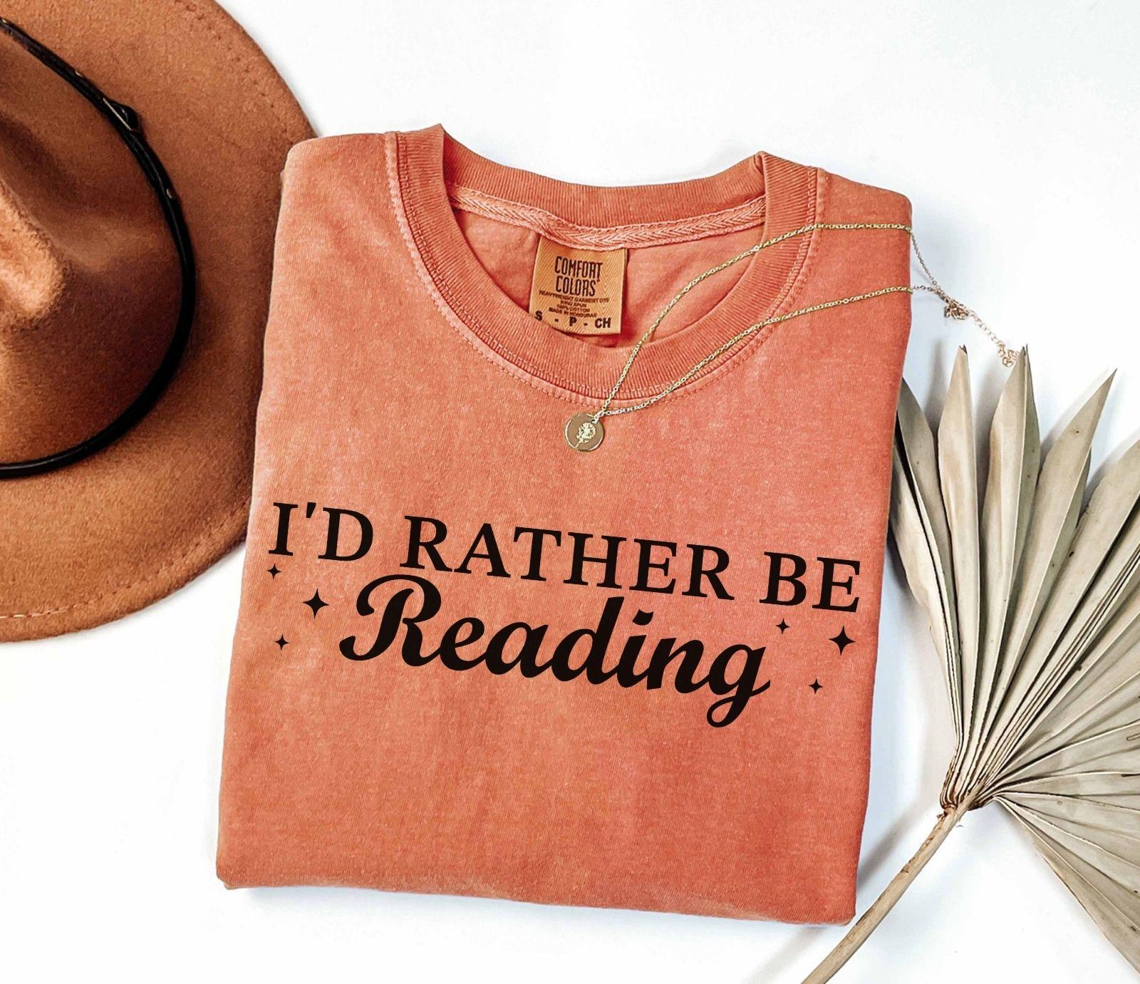 A comfort colors® shirt with the saying "I'd rather be reading"