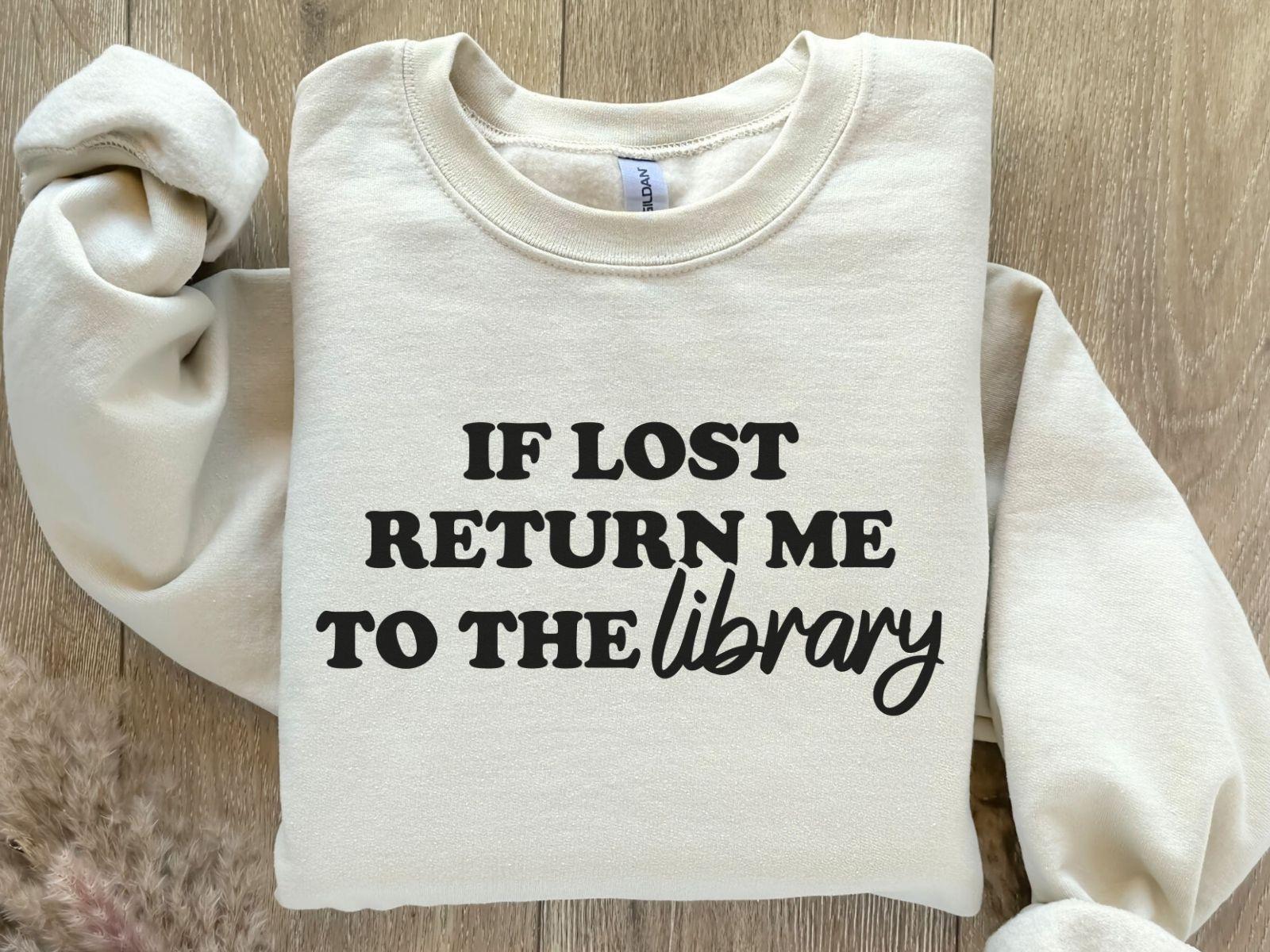 A Gildan 18000 sweatshirt with the saying "if lost return me to the library"