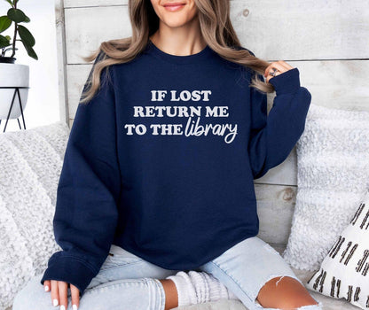 A Gildan 18000 sweatshirt with the saying "if lost return me to the library"