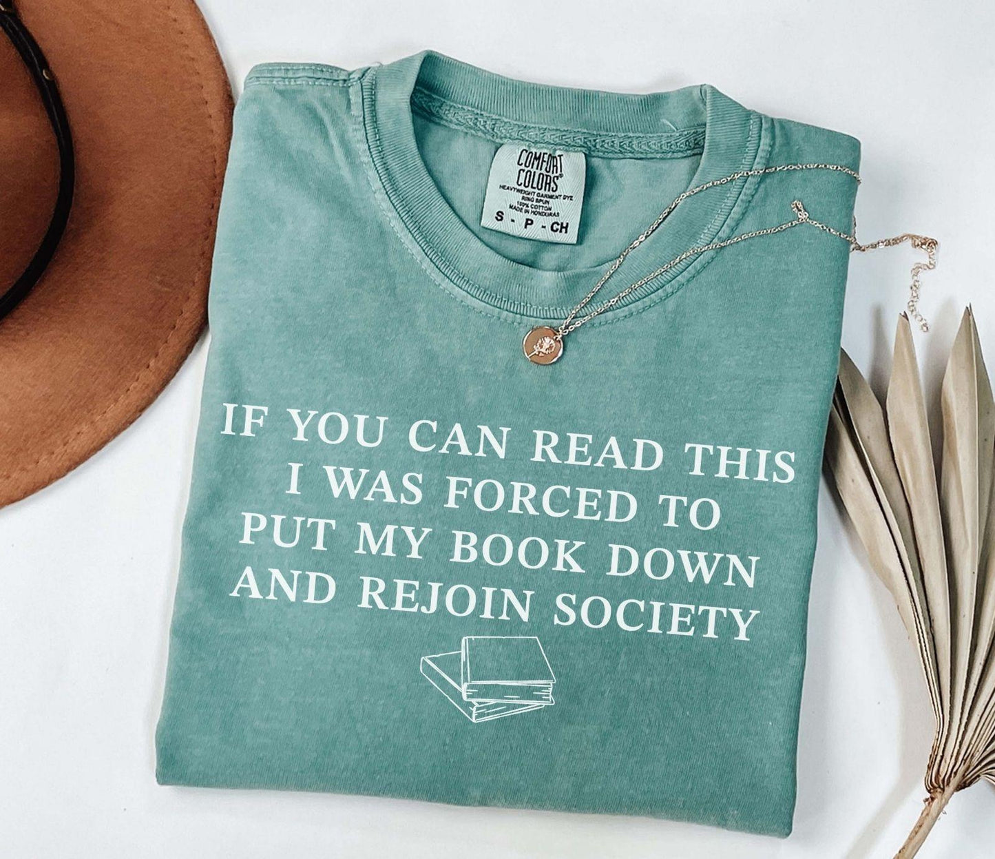 A comfort colors® shirt with the saying "If you can read this I was forced to put my book down and rejoin society"