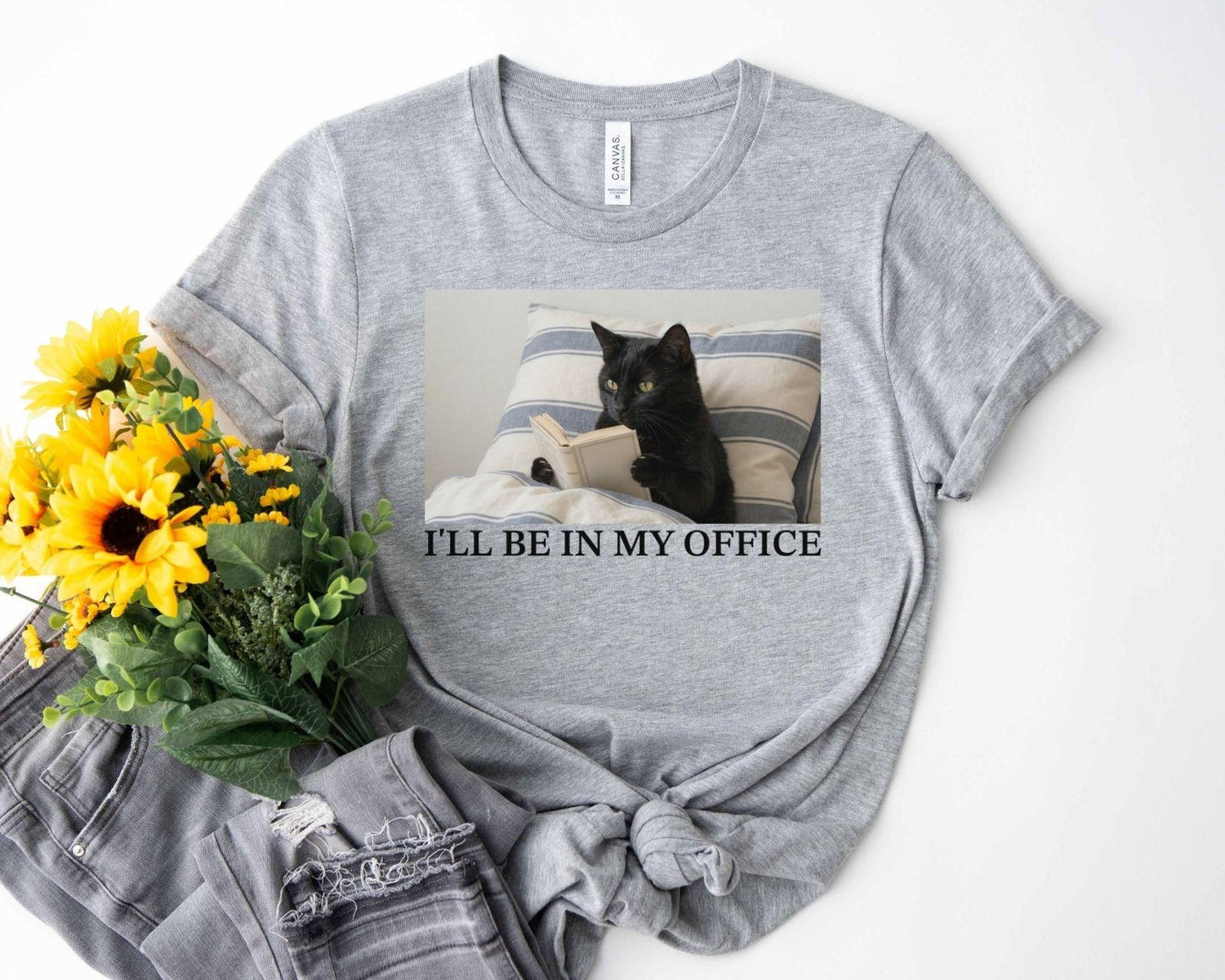 A bella canvas 3001 shirt with the saying "I'll be in my office"