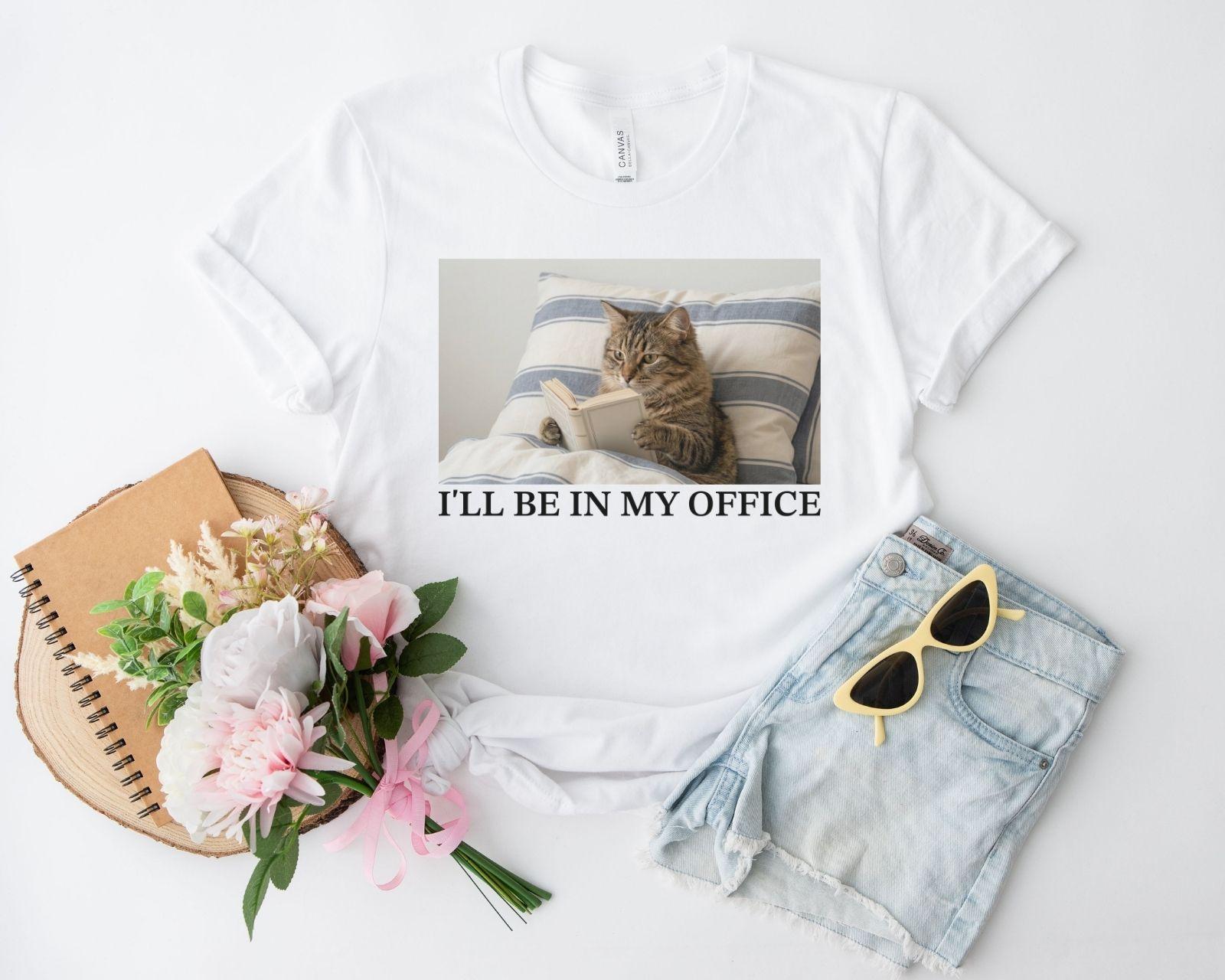 A bella canvas 3001 shirt with the saying "I'll be in my office"