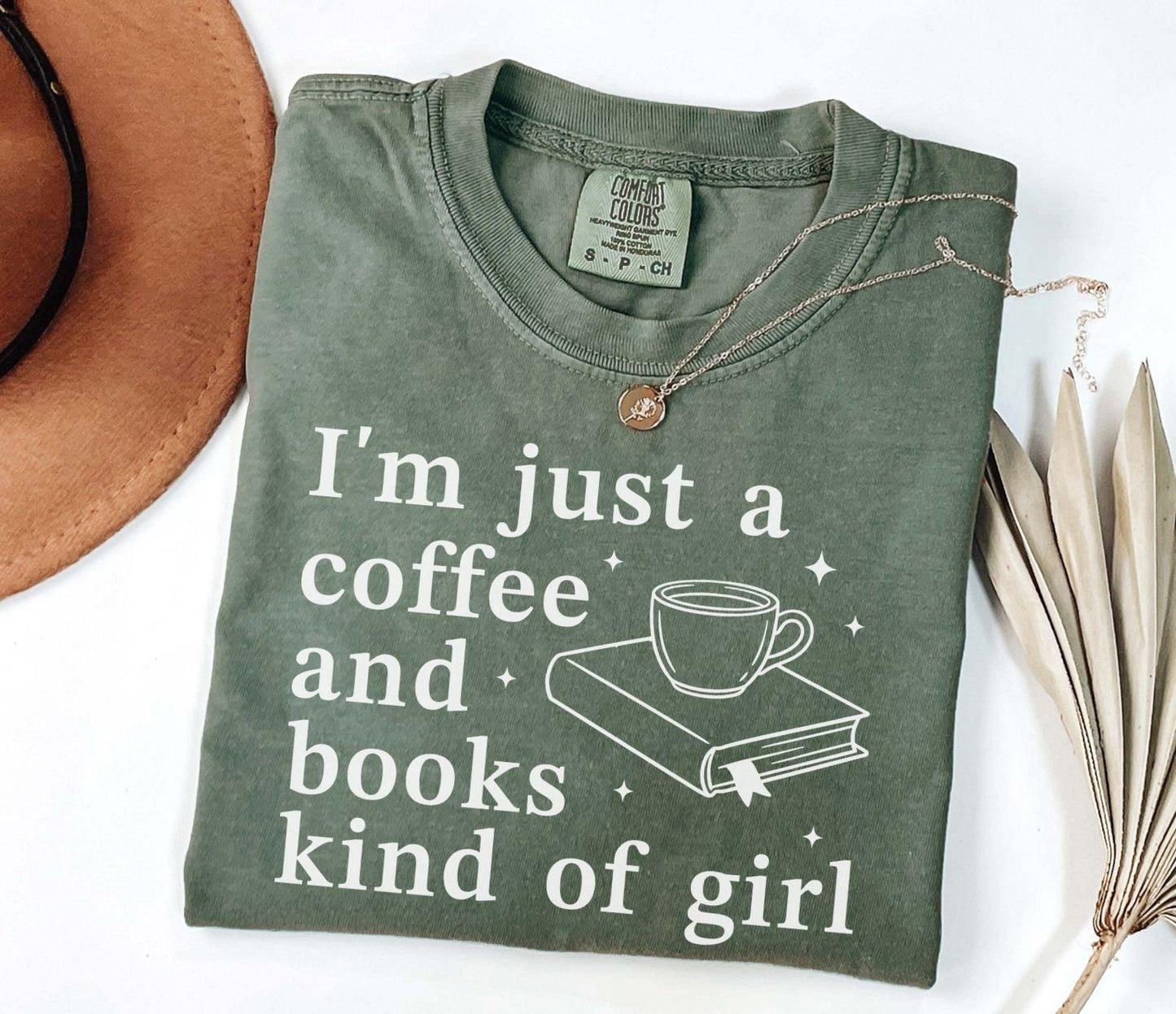 A comfort colors® shirt with the saying "I'm just a coffee and books kind of girl"