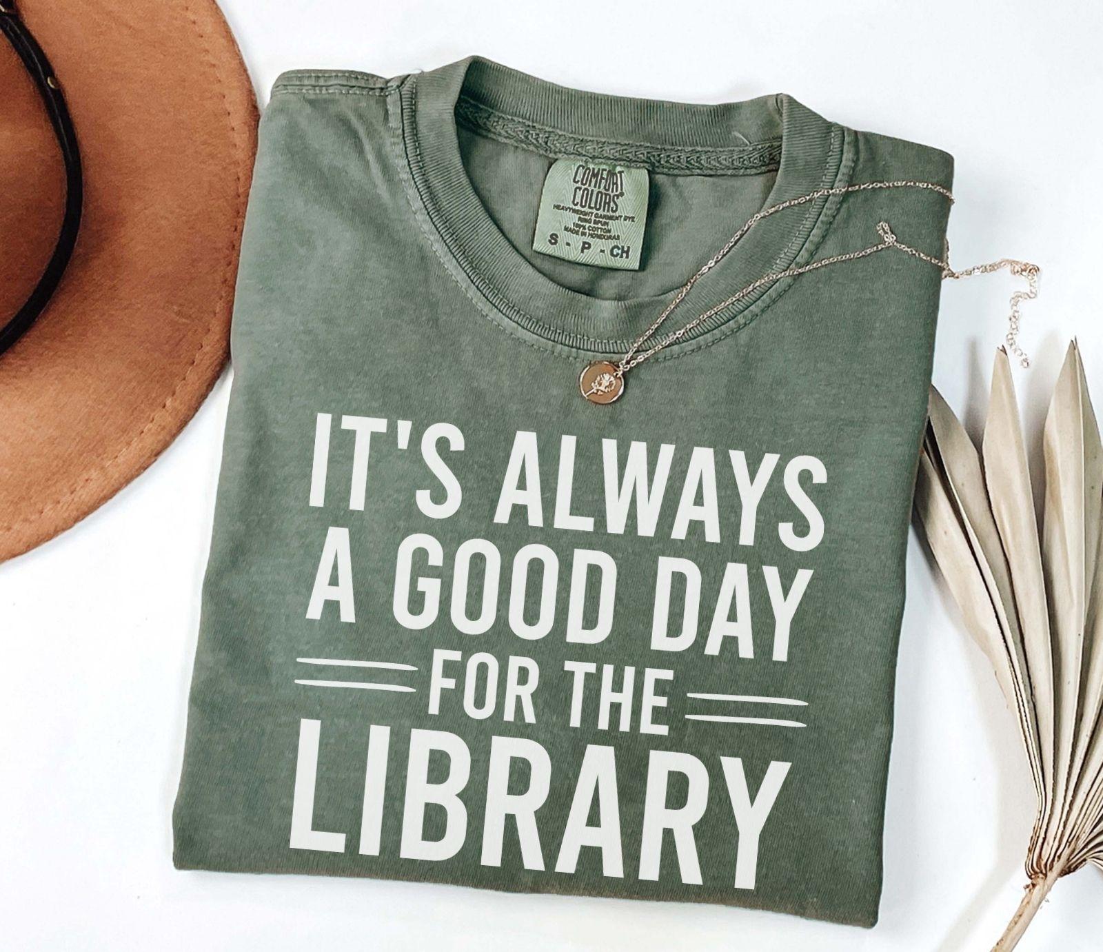 A comfort colors® shirt with the saying "It's always a good day for the library"