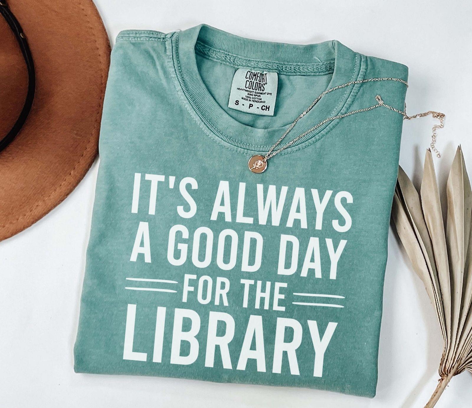 A comfort colors® shirt with the saying "It's always a good day for the library"