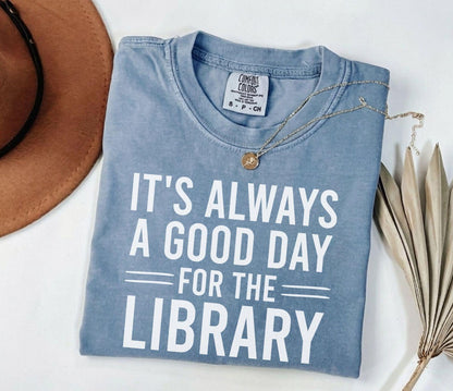 A comfort colors® shirt with the saying "It's always a good day for the library"