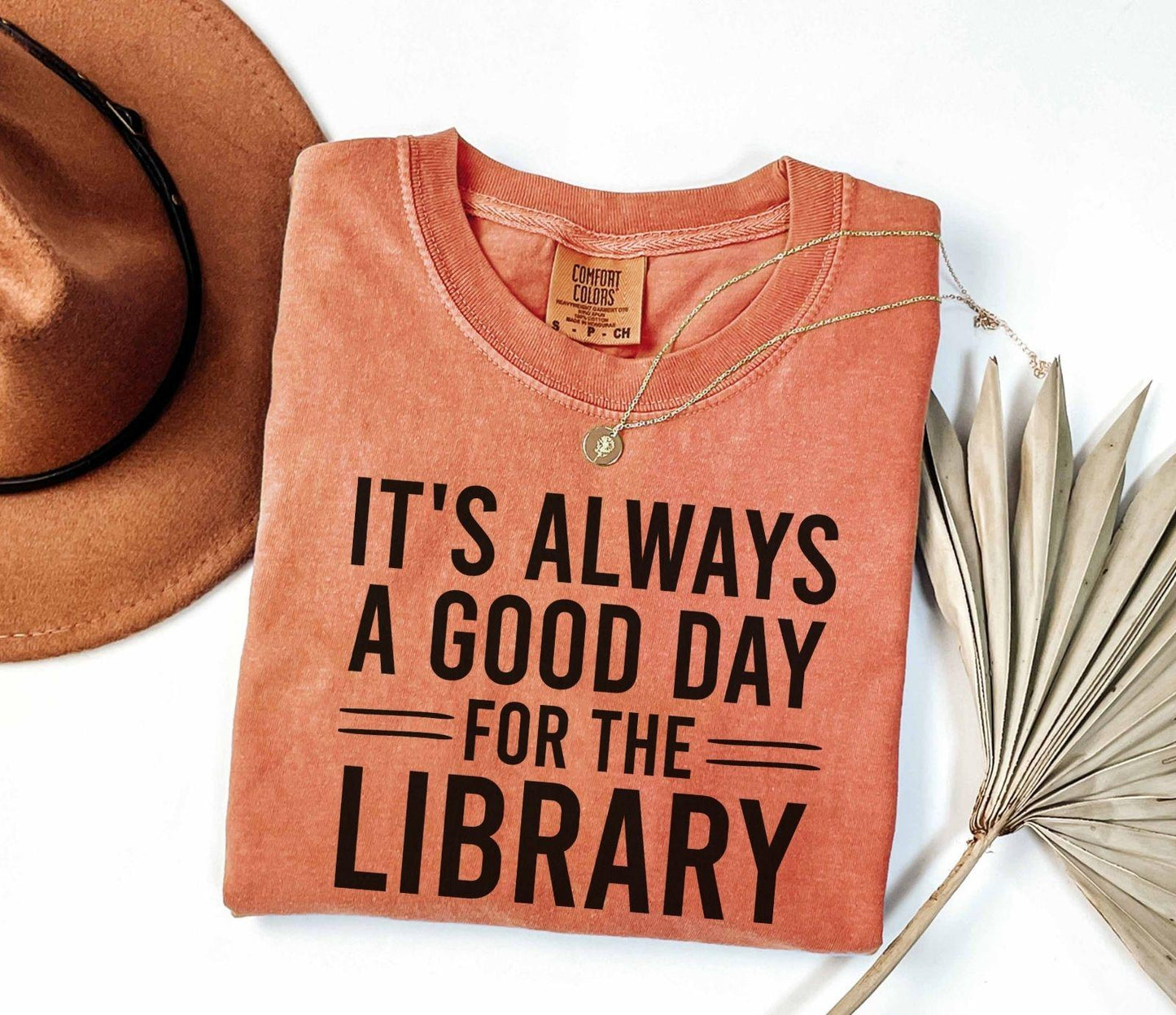 A comfort colors® shirt with the saying "It's always a good day for the library"