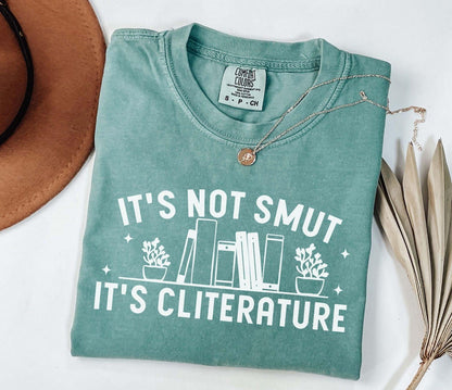 A comfort colors shirt with the saying "It's not smut it's cliterature"