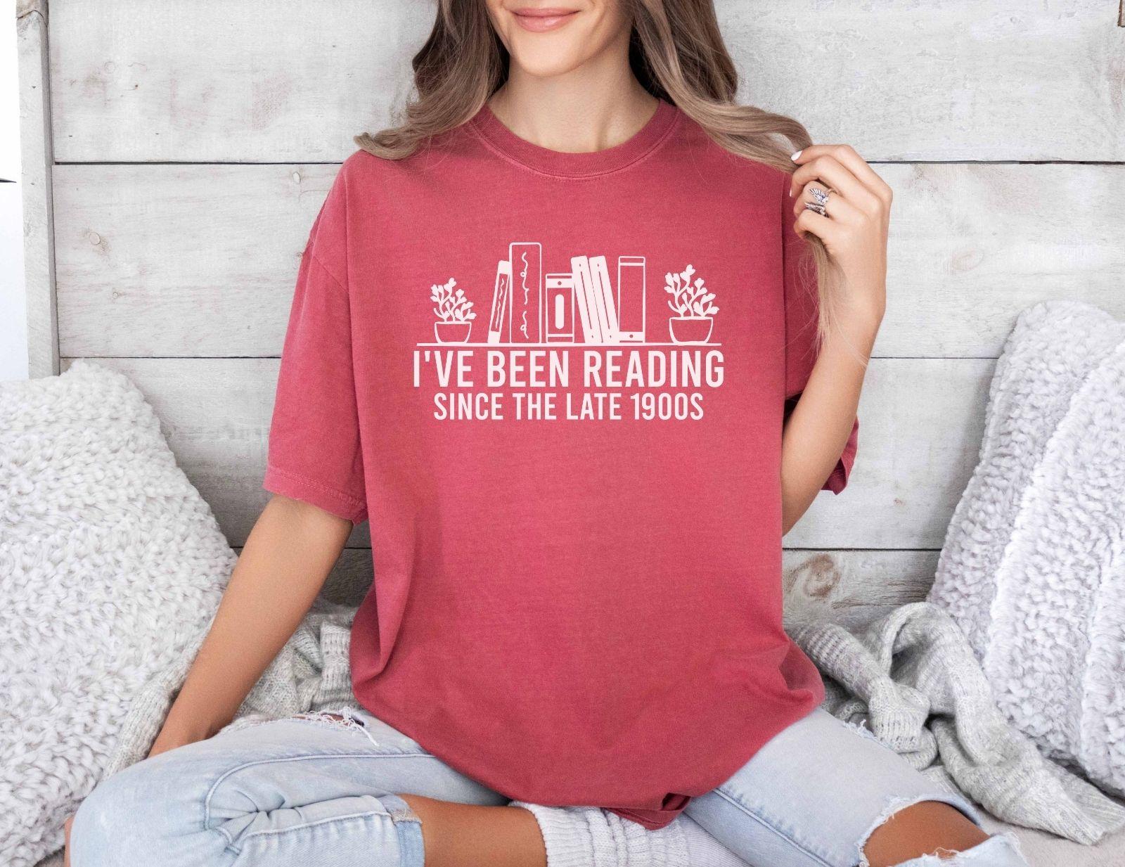A comfort colors® shirt with the saying "i've been reading since the late 1900s"