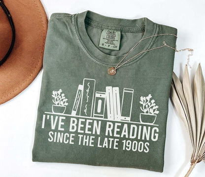 A comfort colors® shirt with the saying "i've been reading since the late 1900s"