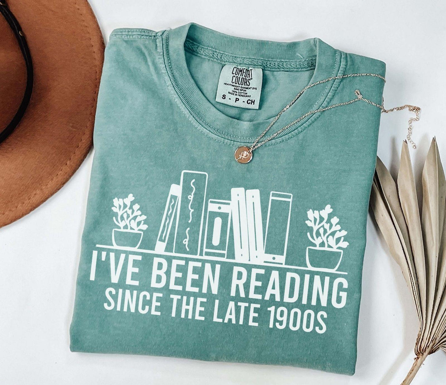 A comfort colors® shirt with the saying "i've been reading since the late 1900s"