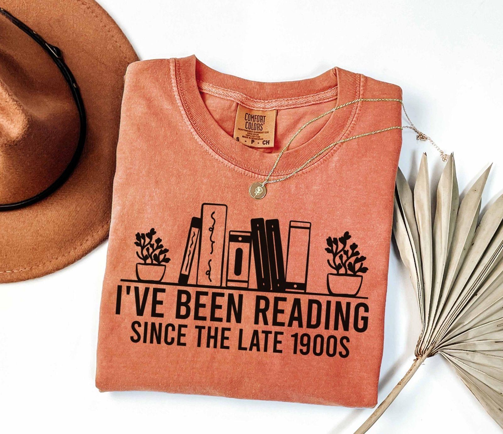 A comfort colors® shirt with the saying "i've been reading since the late 1900s"