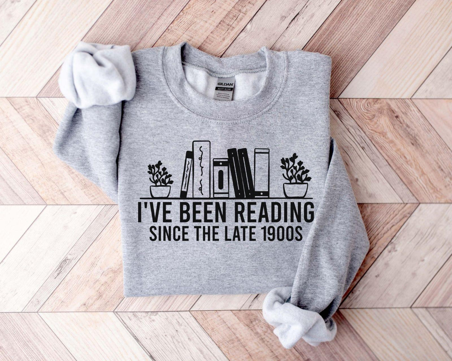 A Gildan 18000 sweatshirt with the saying "I've been reading since the late 1900s"
