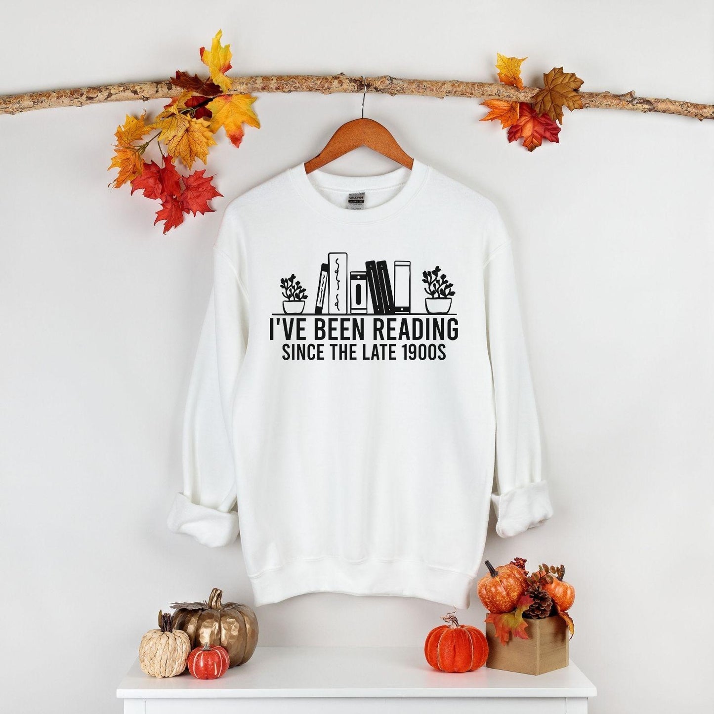 A Gildan 18000 sweatshirt with the saying "I've been reading since the late 1900s"