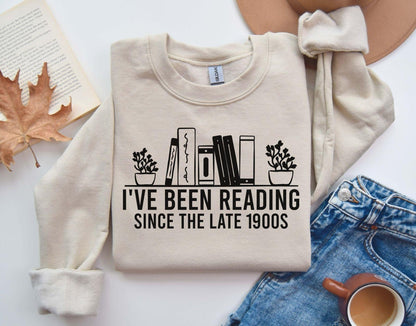A Gildan 18000 sweatshirt with the saying "I've been reading since the late 1900s"