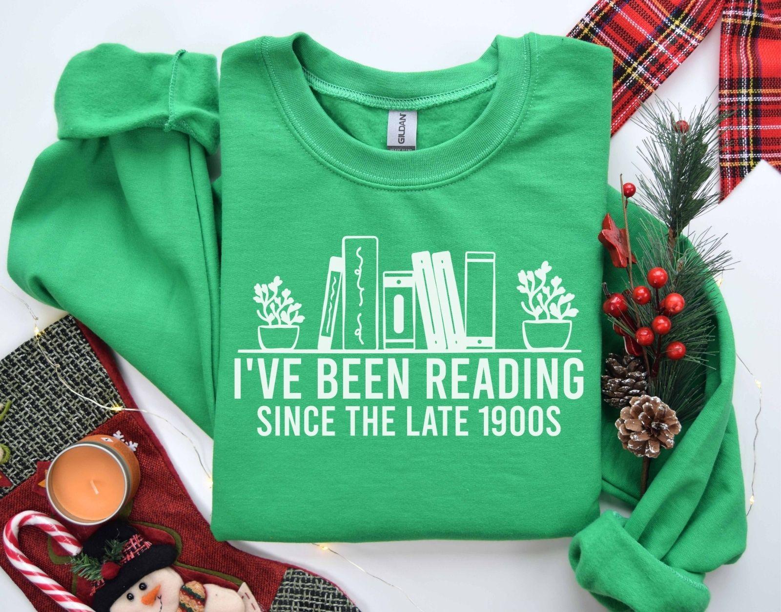 A Gildan 18000 sweatshirt with the saying "I've been reading since the late 1900s"