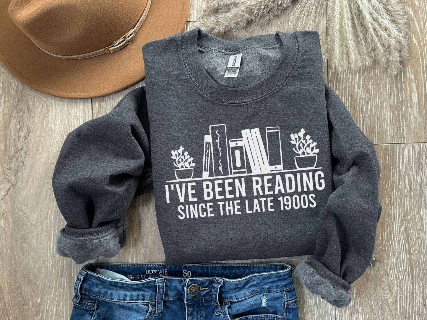 A Gildan 18000 sweatshirt with the saying "I've been reading since the late 1900s"