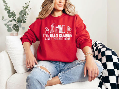 A Gildan 18000 sweatshirt with the saying "I've been reading since the late 1900s"
