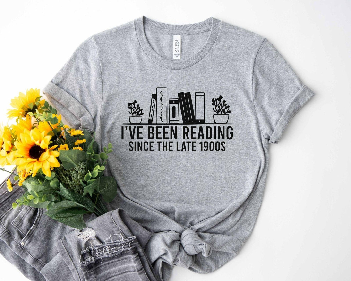 A bella canvas 3001 shirt with the saying "i've been reading since the late 1900s"