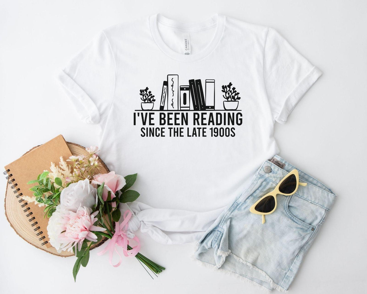 A bella canvas 3001 shirt with the saying "i've been reading since the late 1900s"