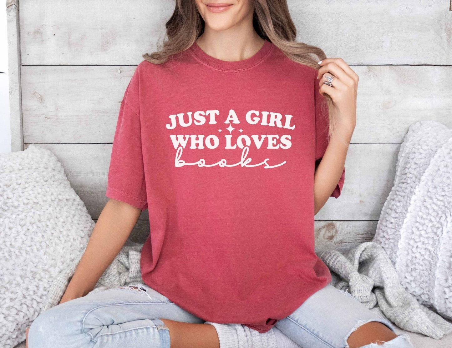 A comfort colors shirt with the saying "Just a girl who loves books"