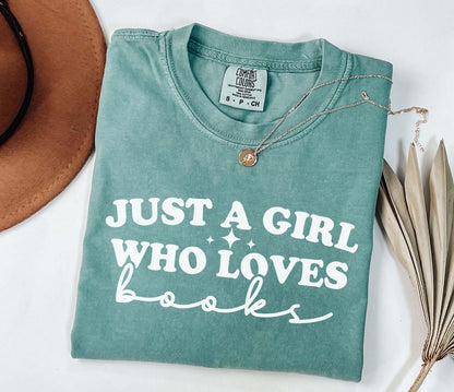 A comfort colors shirt with the saying "Just a girl who loves books"