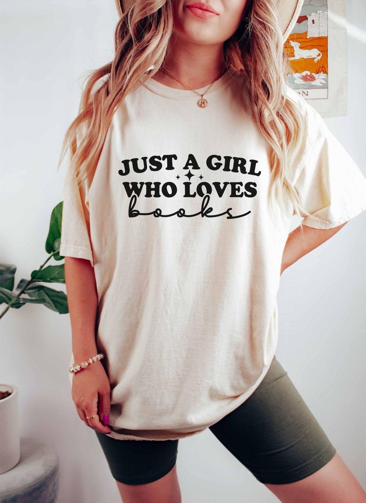 A comfort colors shirt with the saying "Just a girl who loves books"