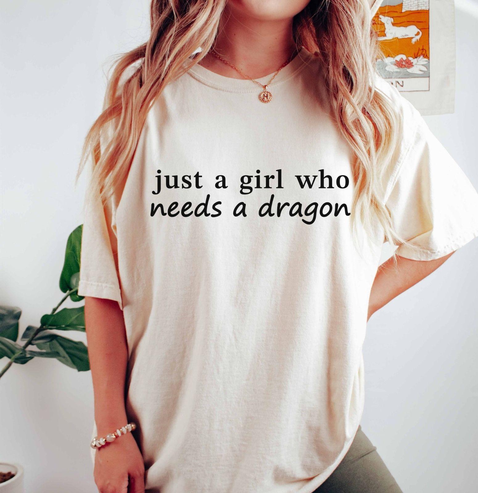 A comfort colors® shirt with the saying "just a girl who needs a dragon"
