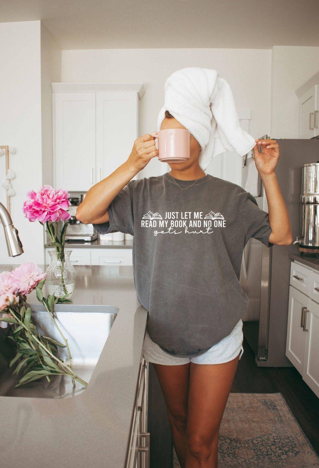 A comfort colors shirt with the saying "just let me read my book and no one gets hurt"