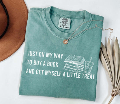 A comfort colors® 1717 shirt with the saying "I just on my way to buy a book and get myself a little treat"