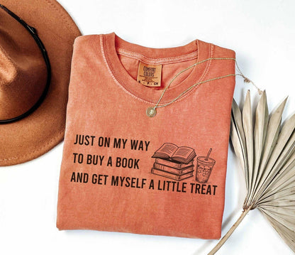 A comfort colors® 1717 shirt with the saying "I just on my way to buy a book and get myself a little treat"