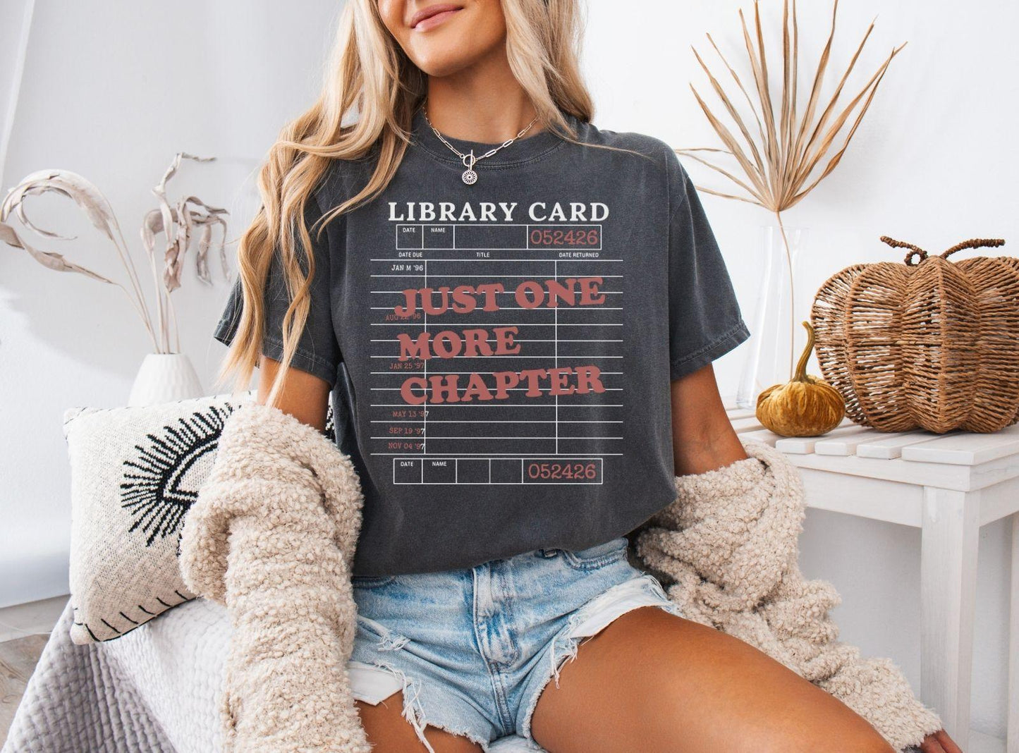 A comfort colors® shirt with the saying "just one more chapter"