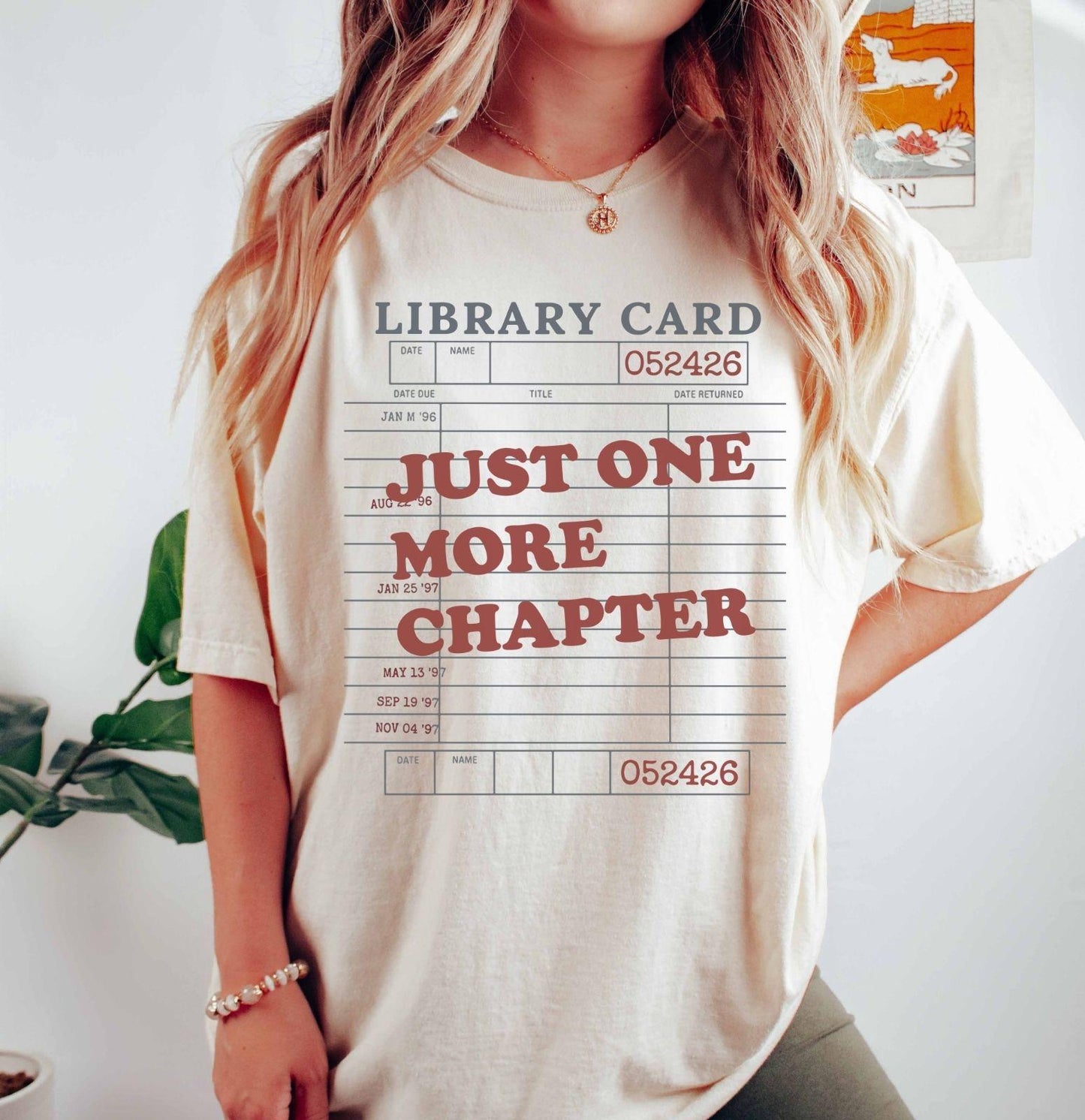 A comfort colors® shirt with the saying "just one more chapter"