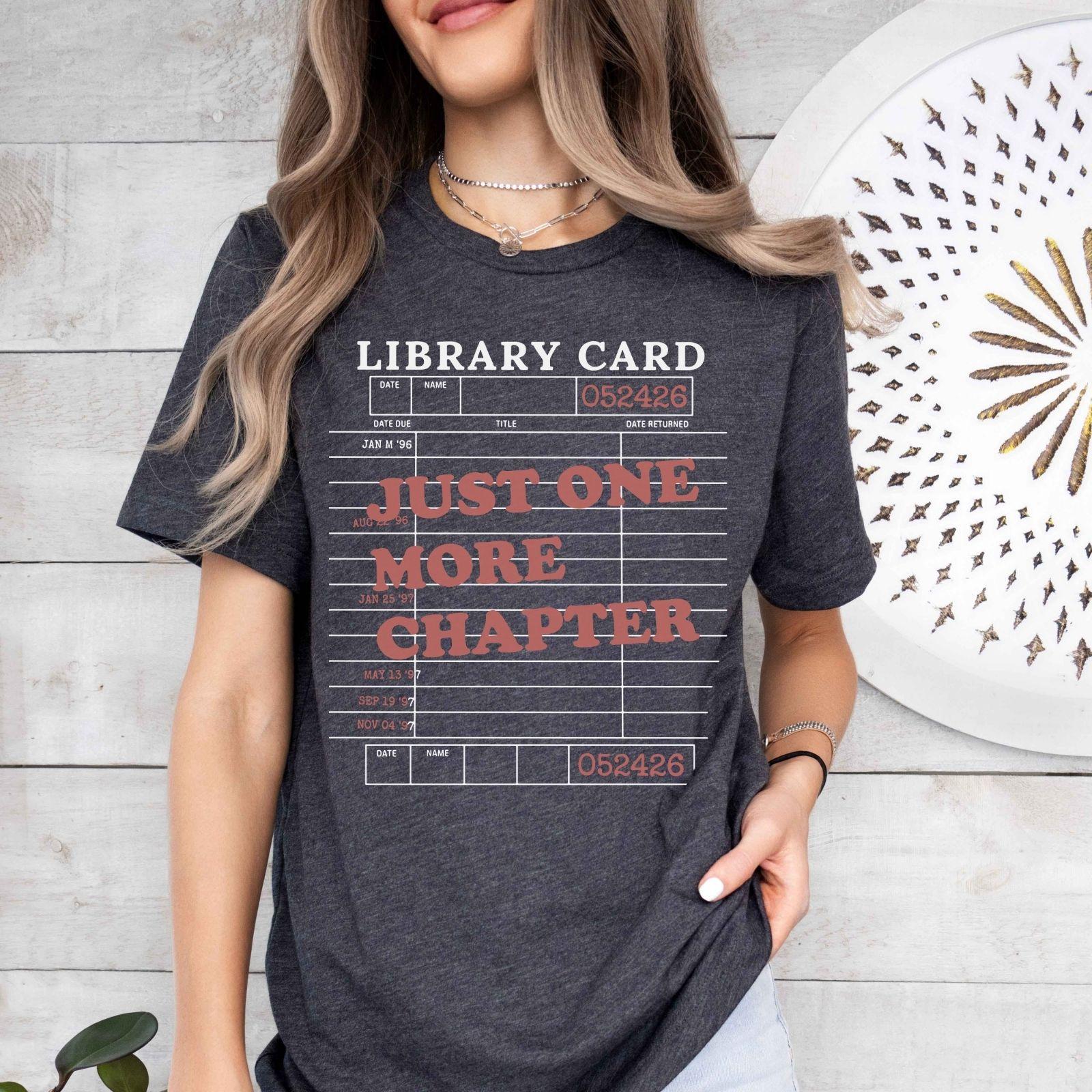 A bella canvas 3001 shirt with the saying "Just one more chapter"