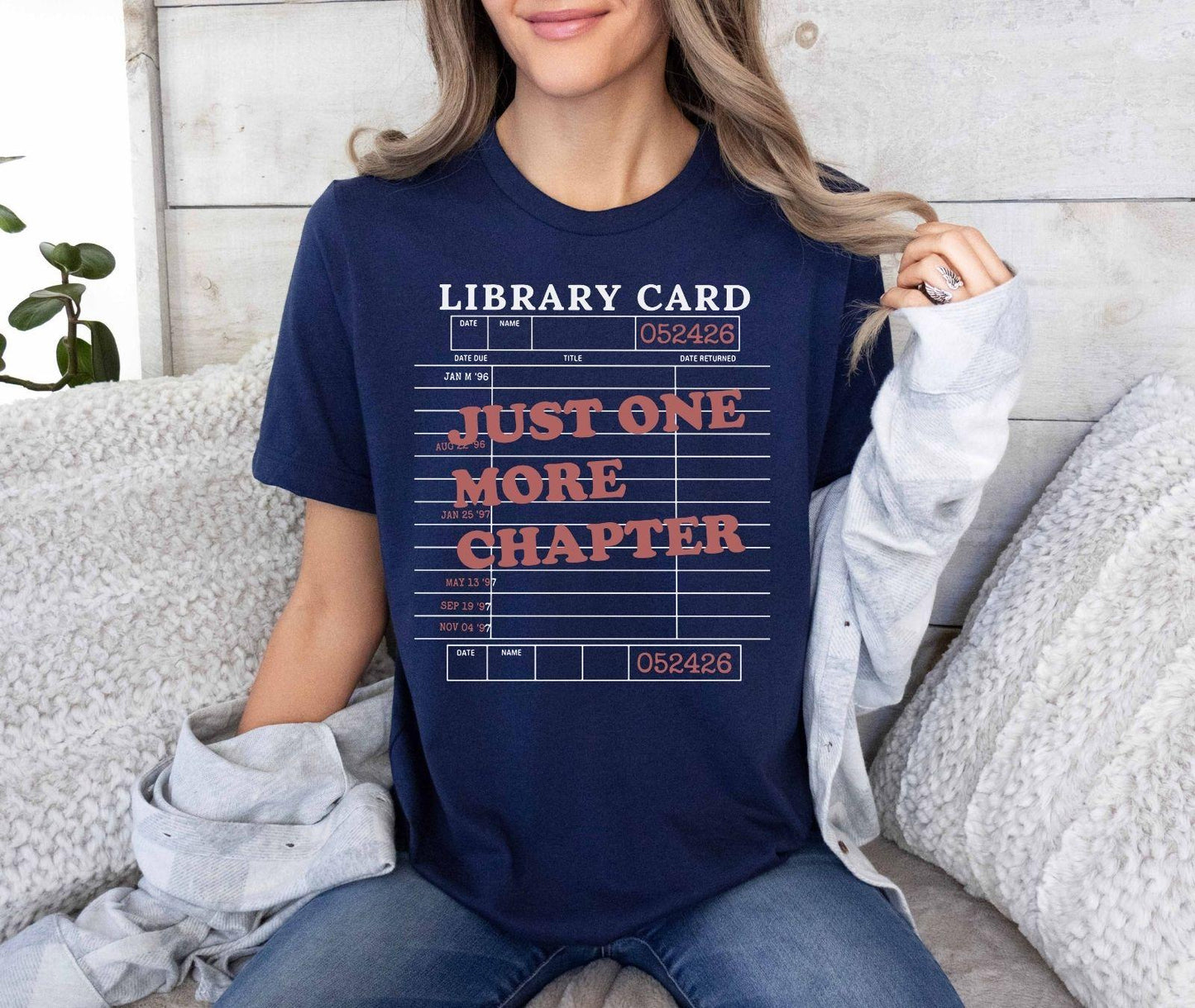 A bella canvas 3001 shirt with the saying "Just one more chapter"