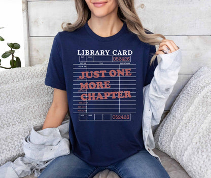 A bella canvas 3001 shirt with the saying "Just one more chapter"